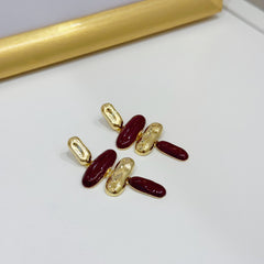 Orecchini oro e bordeaux